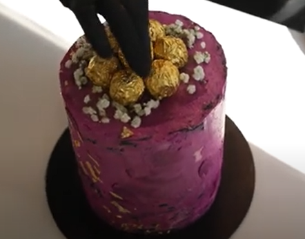 Load video: Chocolate getting poured over a fresh strawberry.